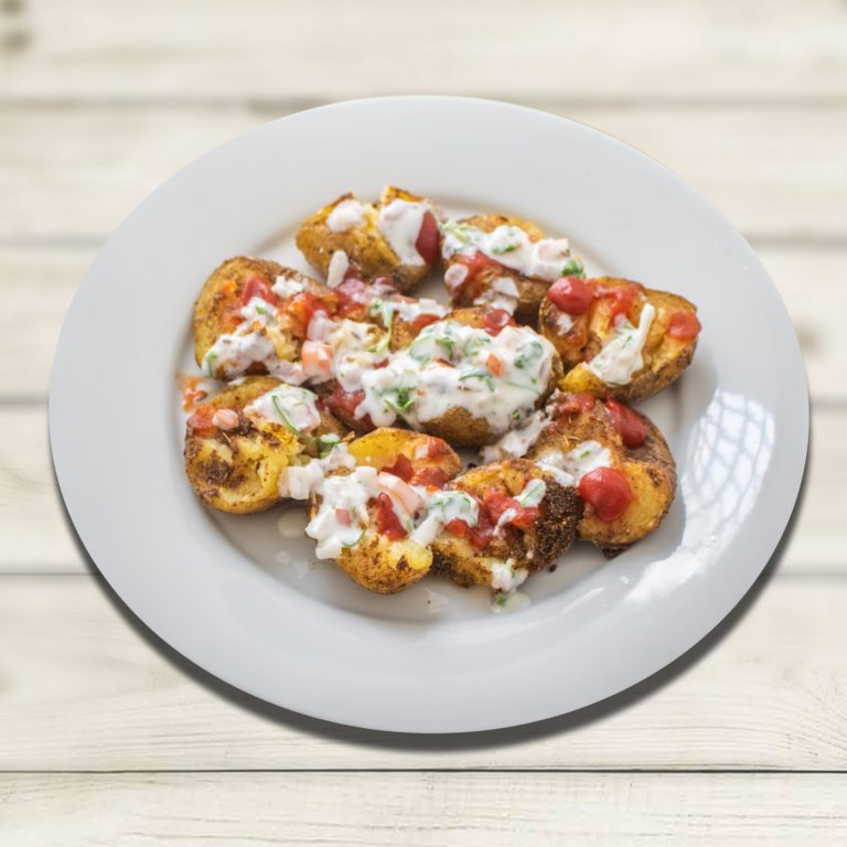 SMASHED MASALA POTATOES, GARLIC CHUTNEY & PRESERVED LEMON RAITA